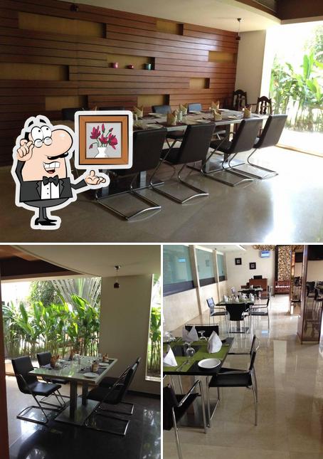 The interior of Blue Bell Multi Cuisine Restaurant - Flora Airport Hotel