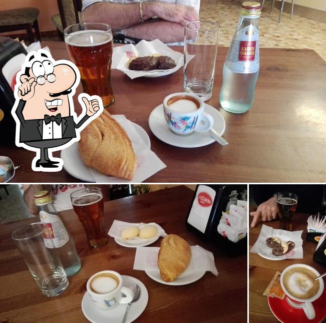 Dai un'occhiata agli interni di Bar Al Cacciatore