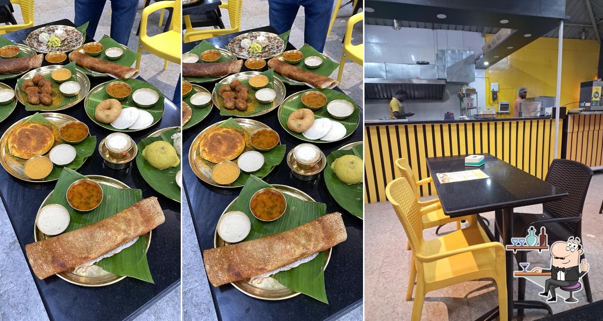 Take a seat at one of the tables at Dvg Benne Dosa Talegaon