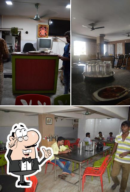 The interior of Navya Restaurant AC
