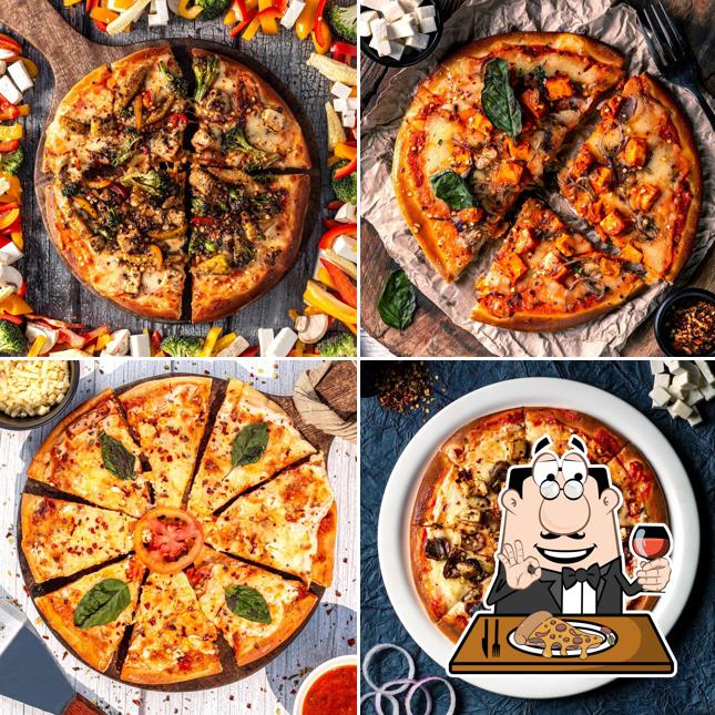 Get pizza at The Badnaam Adda TBA_Best Restaurant in Delhi