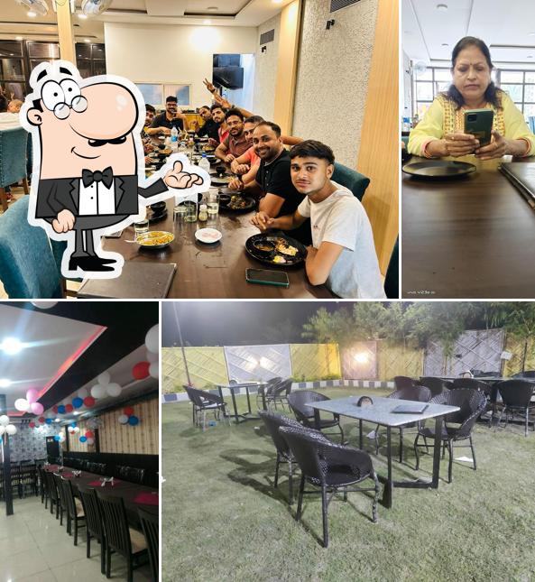 Take a seat at one of the tables at Kanha Restaurant - Unit of TTB Greens