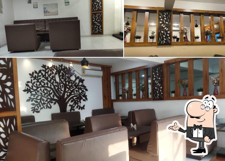 Take a seat at one of the tables at Bahar Biryani Cafe Ameerpet