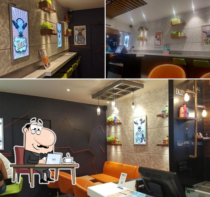 Take a seat at one of the tables at Frozen Bottle - Milkshakes, Desserts, and Ice Cream