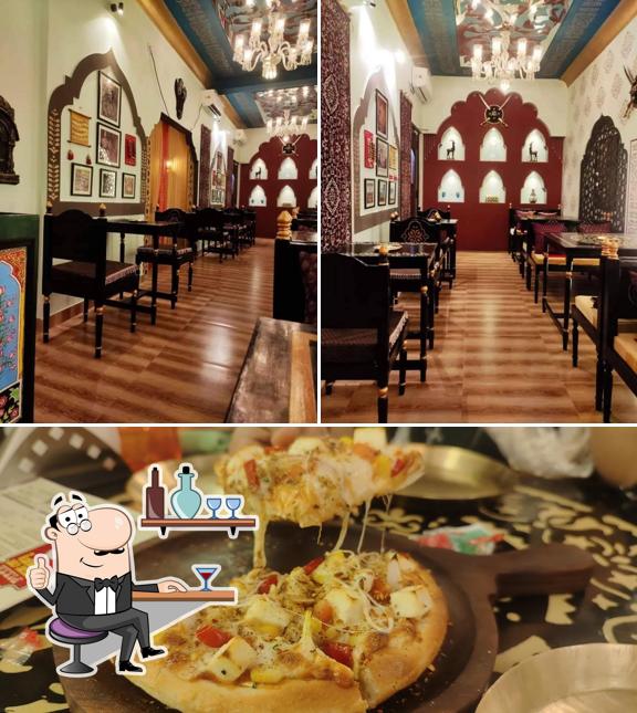 Take a look at the photo displaying interior and food at Bong Pizza
