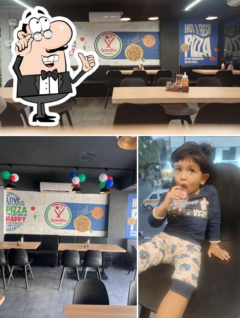 The photo of Spedito Pizzeria Jamnagar’s interior and exterior