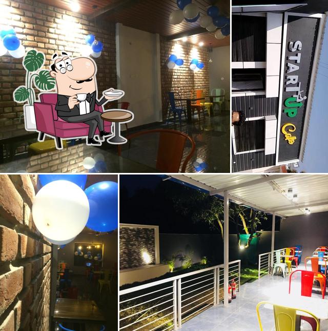 Take a seat at one of the tables at Startup Cafe and Bar