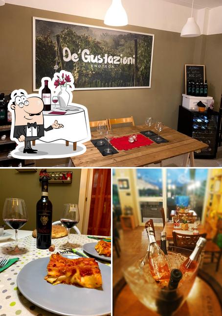 Degustazioni Shop enoteca, degusteria, bottiglieria si caratterizza per la tavolo da pranzo e cibo