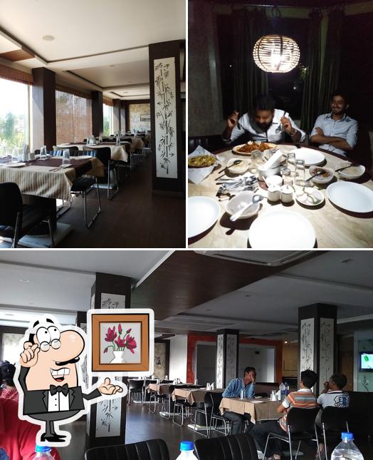 Take a seat at one of the tables at Hotel Ashiyana