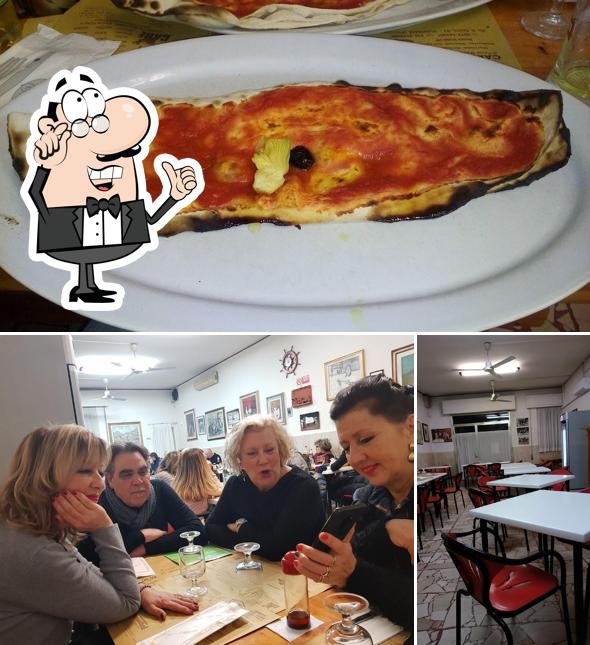 Tra le diverse cose da BAR PIZZERIA GINA si possono trovare la interni e cibo