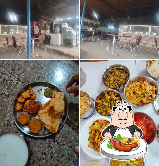 Check out the image displaying food and interior at Pahalwan dhaba