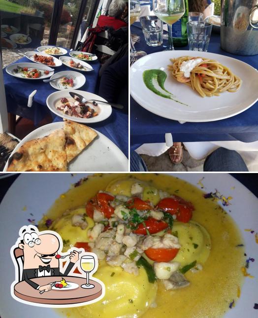 La foto della cibo e tavolo da pranzo di L'Approdo di Augusto - Ristorante di Pesce e Pizzeria sul mare a Sabaudia