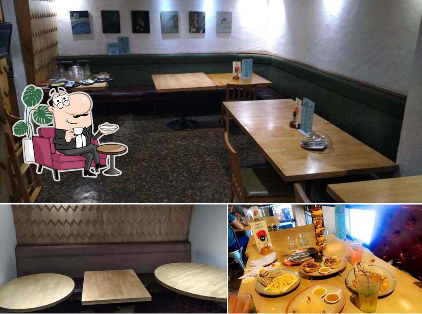 Take a seat at one of the tables at Nando's