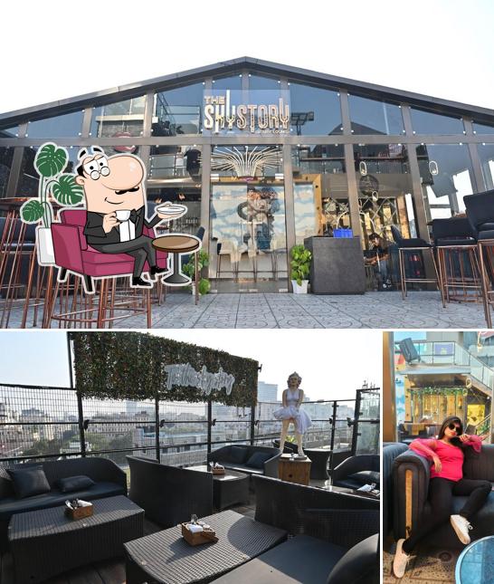 The interior of The Sky Story Luxury Lounge - Rooftop Glasshouse Skydine Cafe