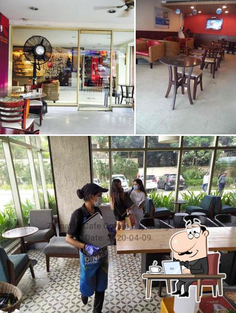 Take a seat at one of the tables at Café Coffee Day