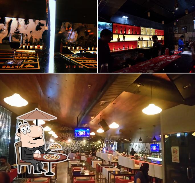 Take a look at the image showing exterior and bar counter at The Studio Bar