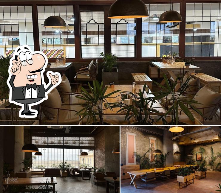 Take a seat at one of the tables at AMA Cafe Mall of Dehradun