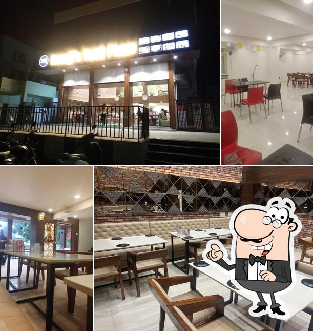 Take a seat at one of the tables at Ramji's Food Plaza