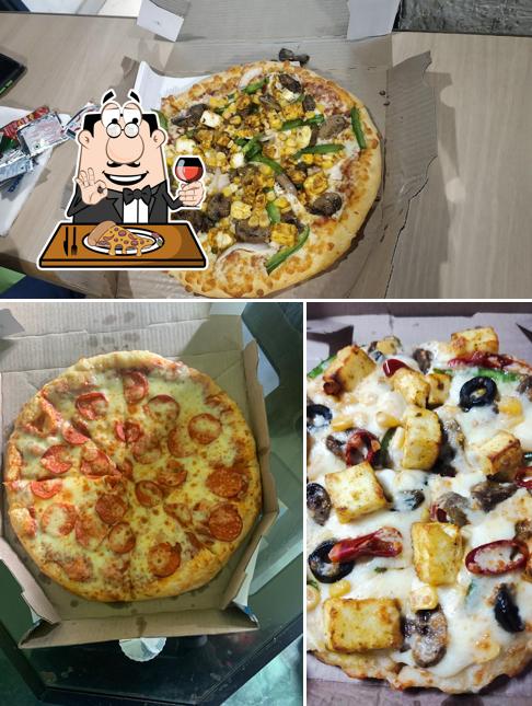 Try out pizza at Domino's Pizza