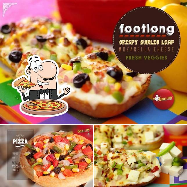 Try out pizza at Grill Inn Parade