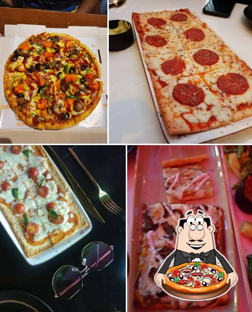 Try out pizza at THE VILLA JUHU