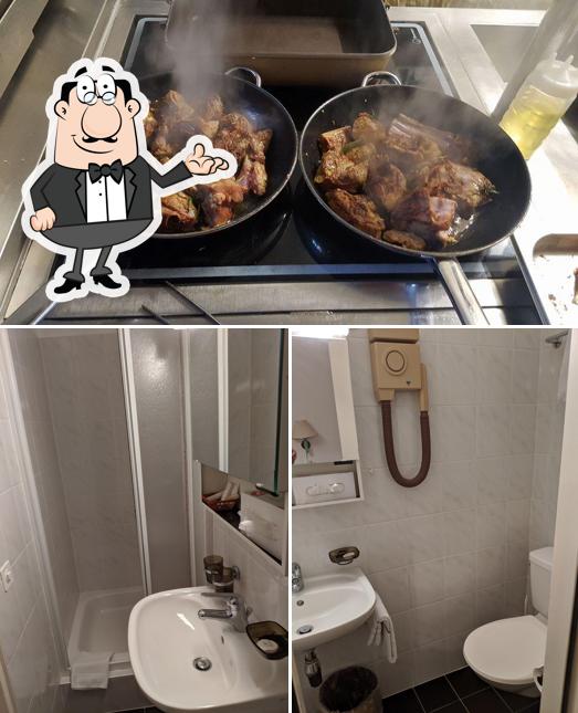Questa è la immagine che presenta la interni e cibo di Hotel Corona