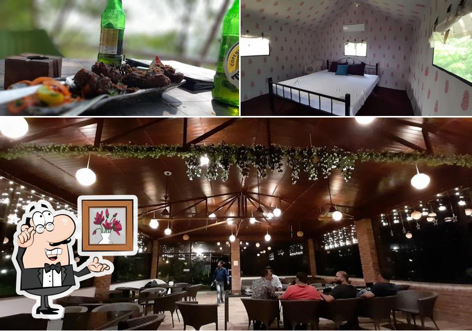 The picture of interior and beverage at Nivasaa, The Nature's Home
