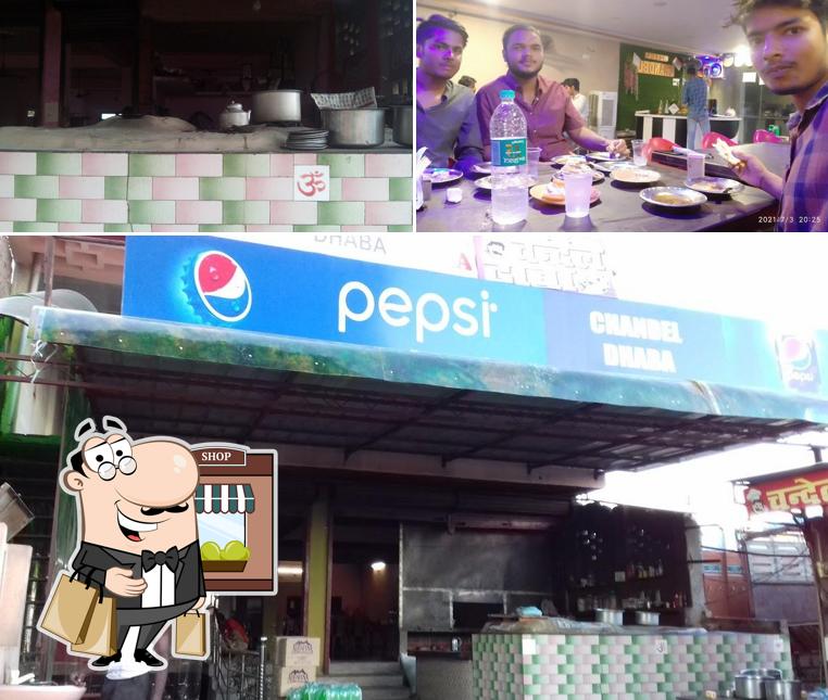 Among different things one can find exterior and dining table at Chandel Dhaba