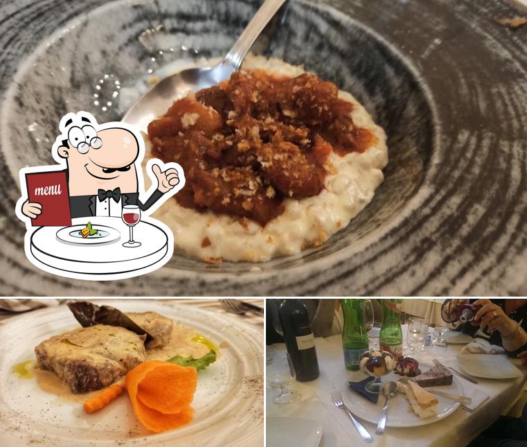La immagine di cibo e tavolo da pranzo da Il Grottino