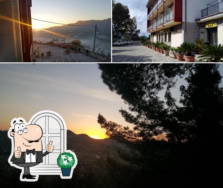 Puoi goderti l'aria fresca da seduto all'esterno di Hotel MillePini