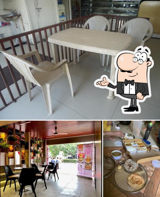 Take a seat at one of the tables at Ame Gujarati QSR