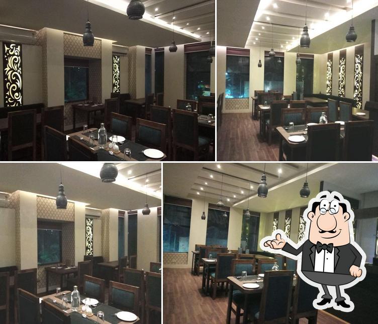 Take a seat at one of the tables at SHUDH Pure veg restaurant