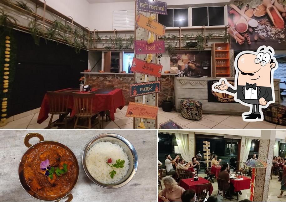 Esta é a imagem apresentando interior e comida no Curry Up! - Bistrô Indiano