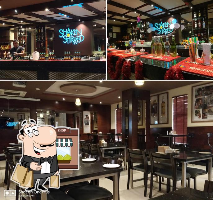 Check out the image displaying exterior and dining table at Shaken & Stirred