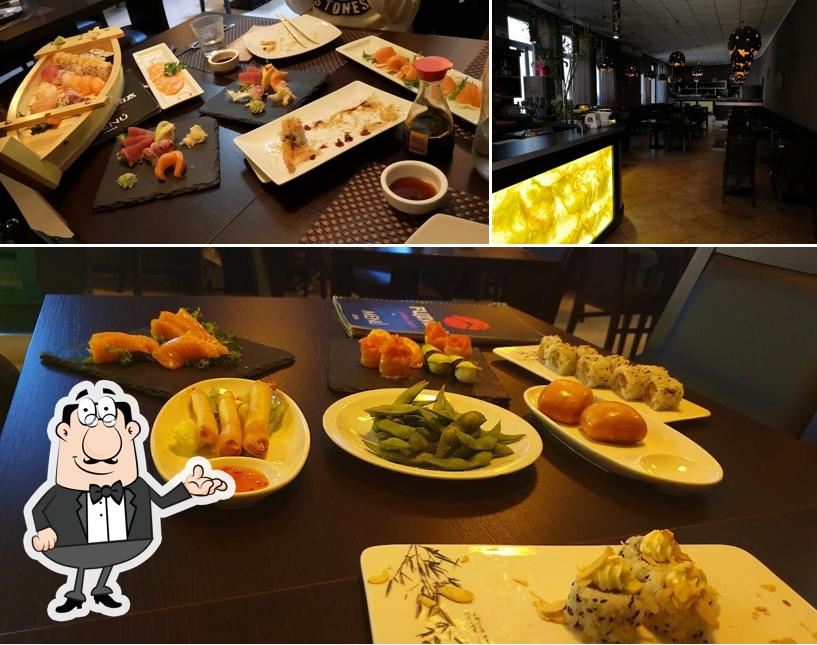 Questa è la foto che raffigura la interni e tavolo da pranzo di Sushi King Iglesias