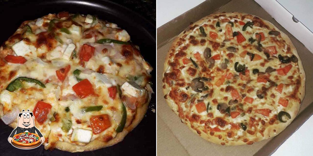 Try out pizza at New Pizza Yum