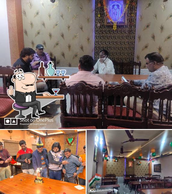 Take a seat at one of the tables at Shri Ram Bhakta Bhojnalaya & Juice - Shake