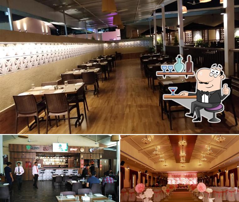 Take a seat at one of the tables at Bird Valley Wakad Restaurant and Bar