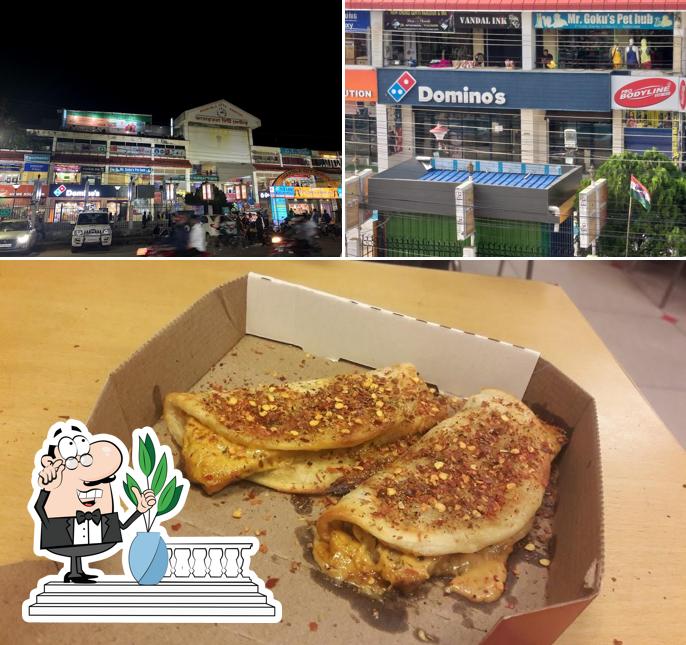 Take a look at the photo displaying exterior and food at Domino's Pizza Dhaleswar, Agartala