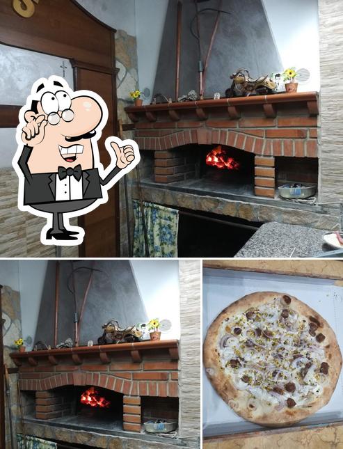 Dai un’occhiata alla immagine che mostra la interni e pizza di Pizzeria Oasis