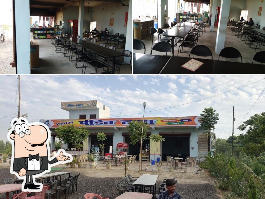 Take a seat at one of the tables at Shubham Pandit Dhaba 2