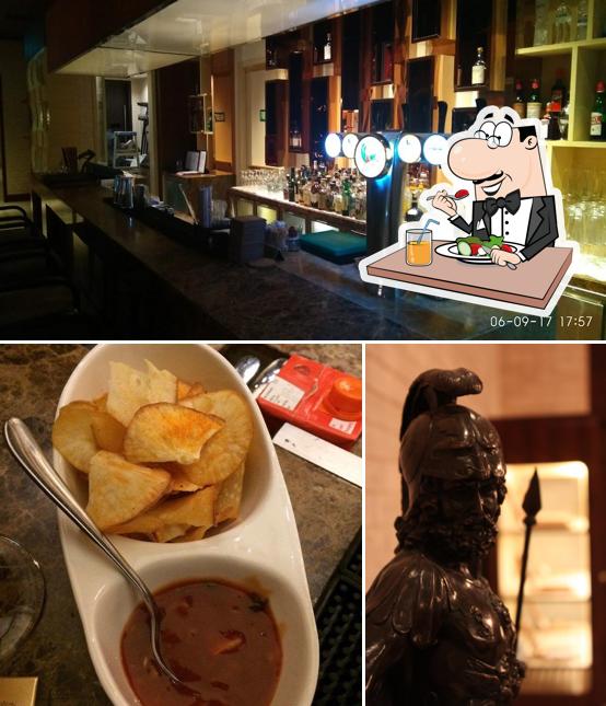 Take a look at the image depicting food and bar counter at The Cheroot Malt Bar