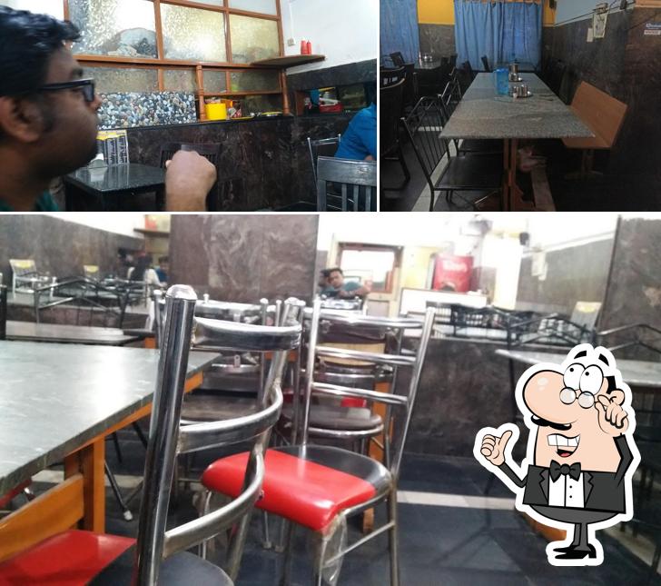 Take a seat at one of the tables at Kairali Restaurant