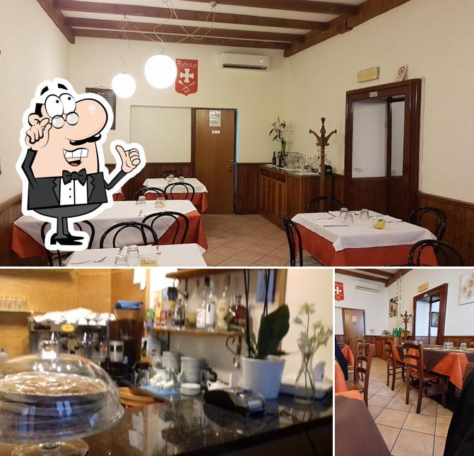 Siediti a un tavolo di TRATTORIA CROCE BIANCA