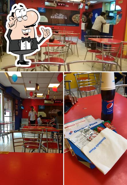Take a seat at one of the tables at Domino's Pizza Prabhat Colony, Jalgaon