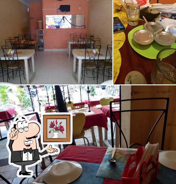 This is the photo showing interior and dining table at Kwanz