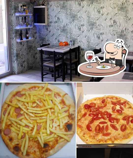Dai un’occhiata alla immagine che raffigura la cibo e interni di Pizzeria il re