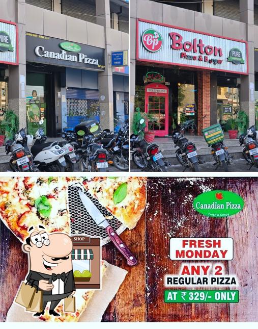 Take a look at the photo displaying exterior and food at Canadian Pizza