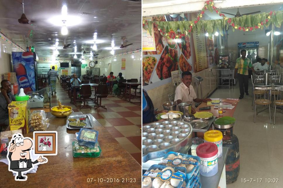 Take a seat at one of the tables at Velmurugan Restaurant