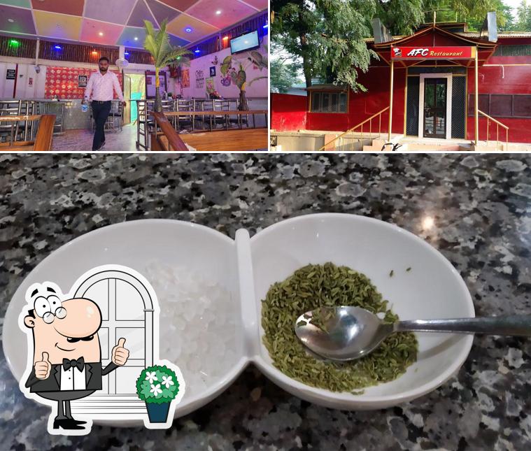 Check out the photo showing exterior and food at AFC Restaurant